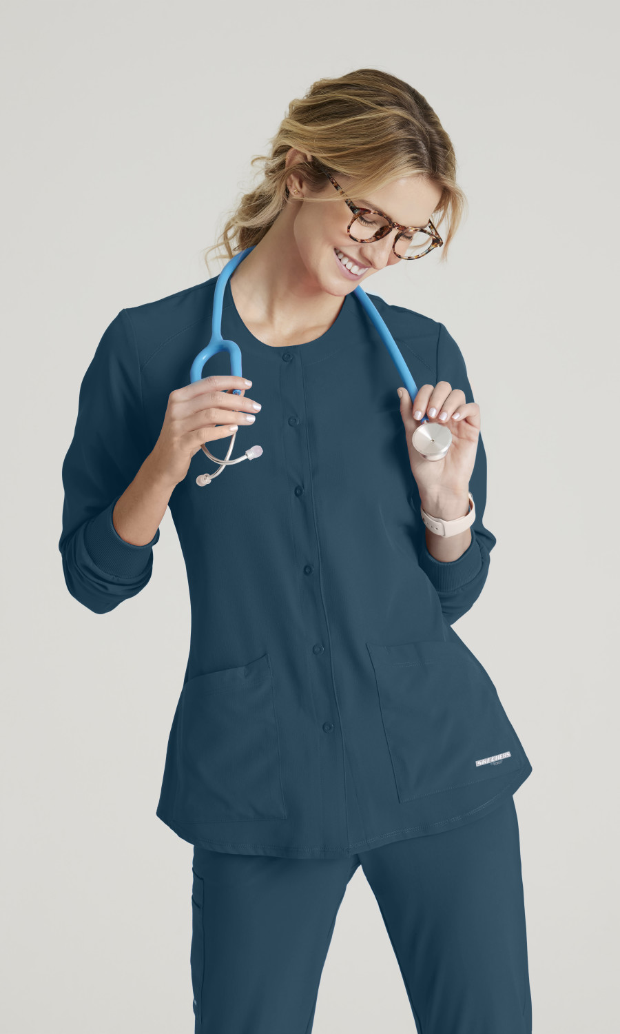 Skechersâ„¢ by Barco Women's 2 Pocket Warm-Up Scrub Jacket With Eco-Friendly Stretch Fabric